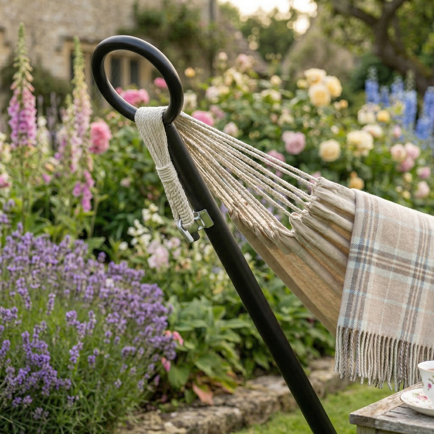 Beige hammock with stand on patio decking