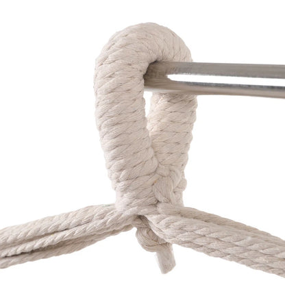 Bohemian chair detail of canvas and tassel fringe