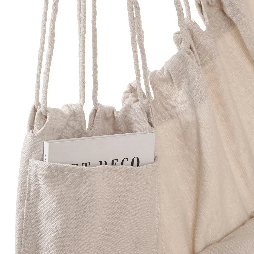 Cream canvas hanging chair with tassels in living room